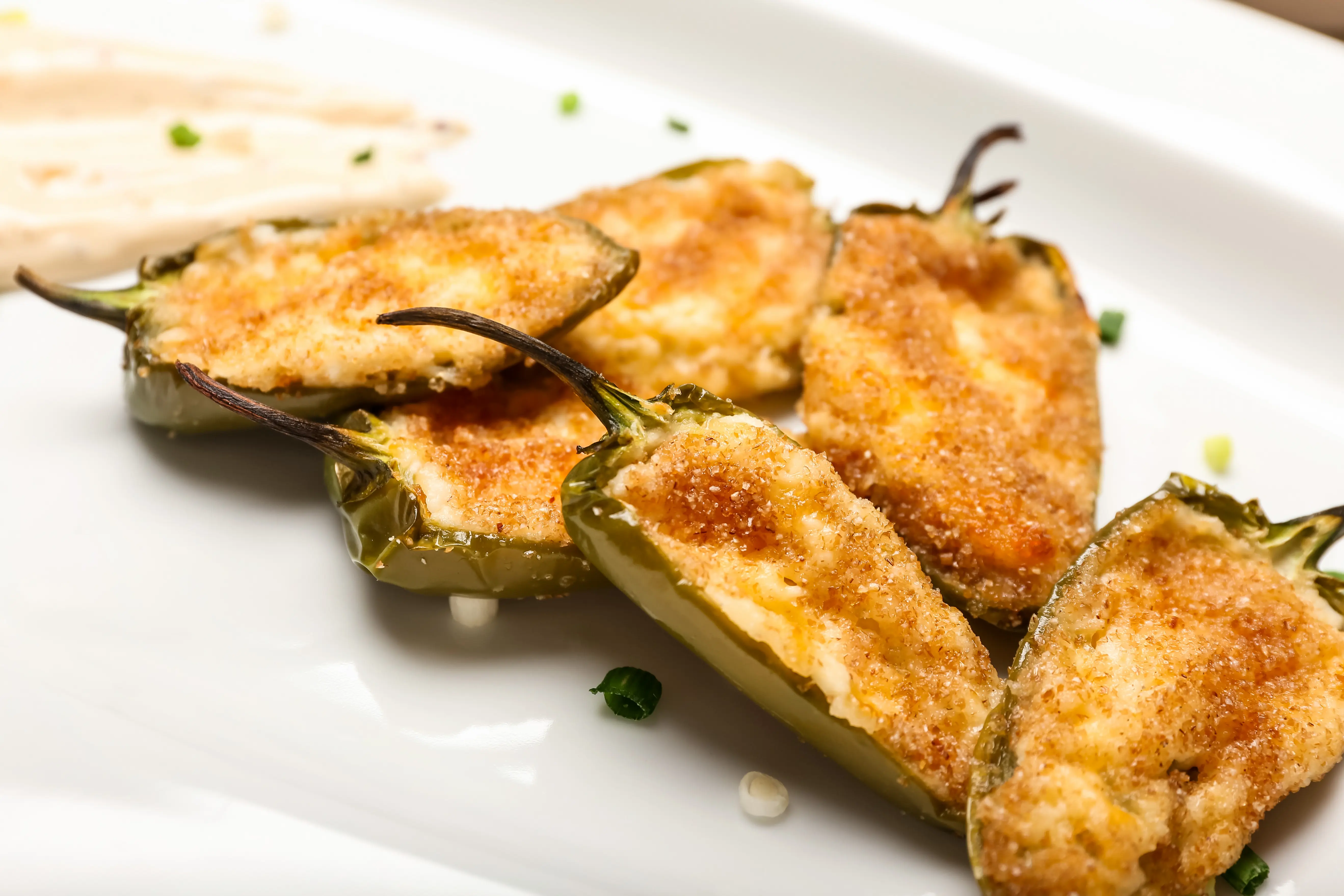 Jalapeno cut in half, filled with cream cheese and bread crums